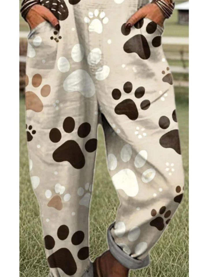Grote maten, elegante overall voor dames in grote maten - Beige en bruine pootafdrukpatronen, machinewasbare polyester overall voor dierenliefhebbers, alledaagse en formele kleding - Comfortabele H-vormige contour met speels dierenpootafdrukontwerp