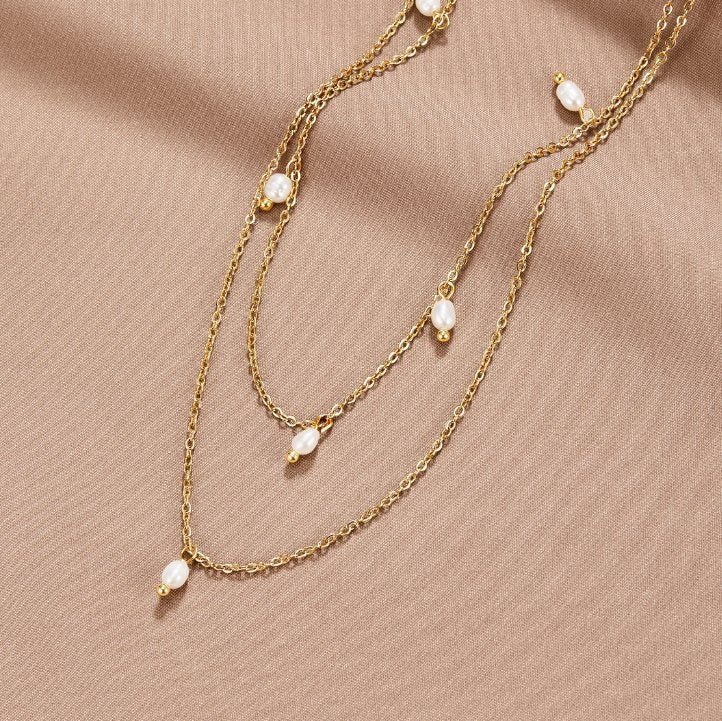 Layered necklace with pearl drops